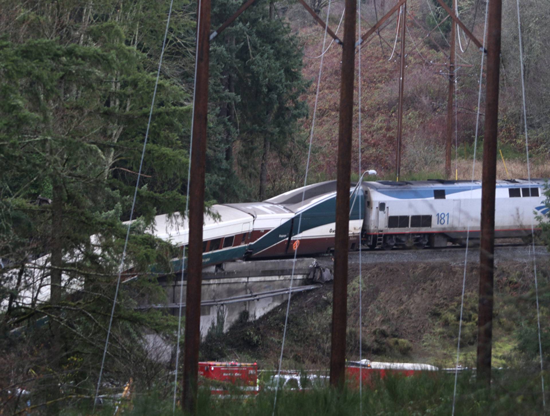 First responders are at the scene of an Amtrak passenger train which derailed and is hanging from a bridge over the I-5 in DuPont