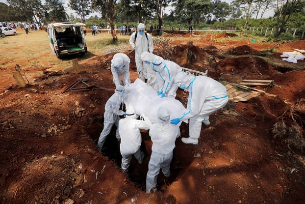 Volunteers from the National Muslim Covid-19 Response Committee work at the muslim cemetery in Nairobi