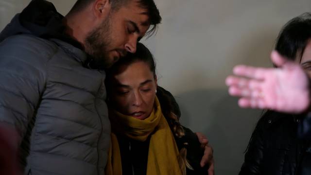 FILE PHOTO: FILE PHOTO: Julen's parents embrace each other during a vigil as a miner rescuer team descends into a drilled well at the area where Julen, a Spanish two-year-old boy, fell into a deep well, in Totalan