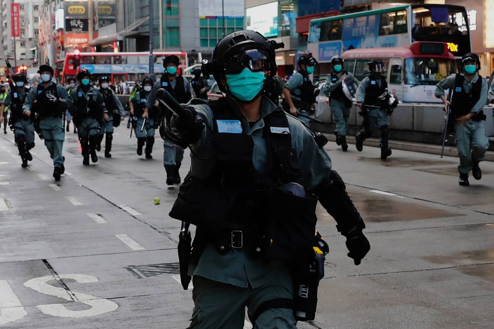 Riot police disperse anti-government protesters during a protest at Mong Kok in Hong Kong