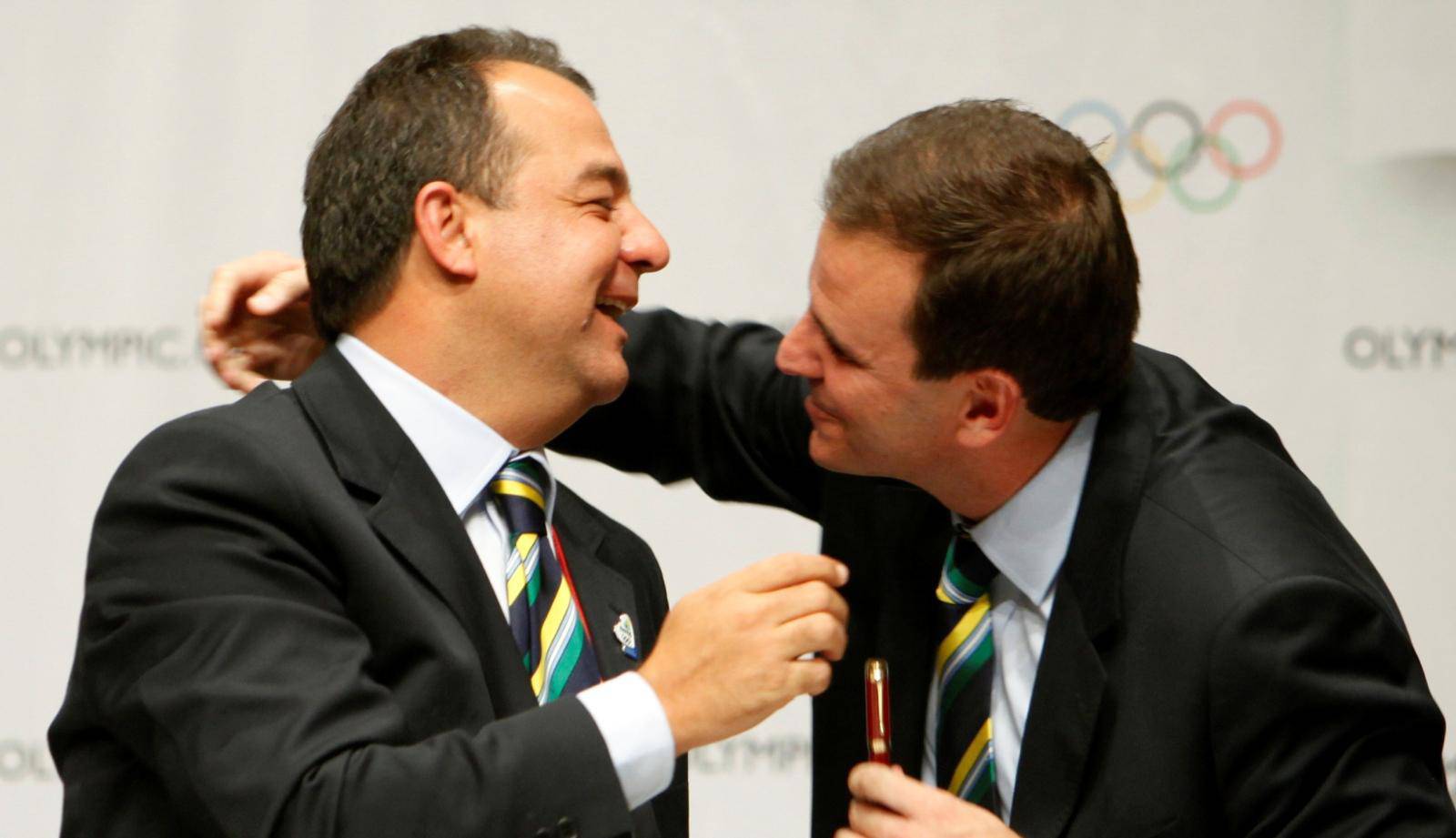 FILE PHOTO:  Brazil's Sergio Cabral, Governor of Rio de Janeiro, and Eduardo Paes, Rio de Janeiro city Mayor, celebrate after Rio was chosen to host the 2016 Olympic Games in Copenhagen