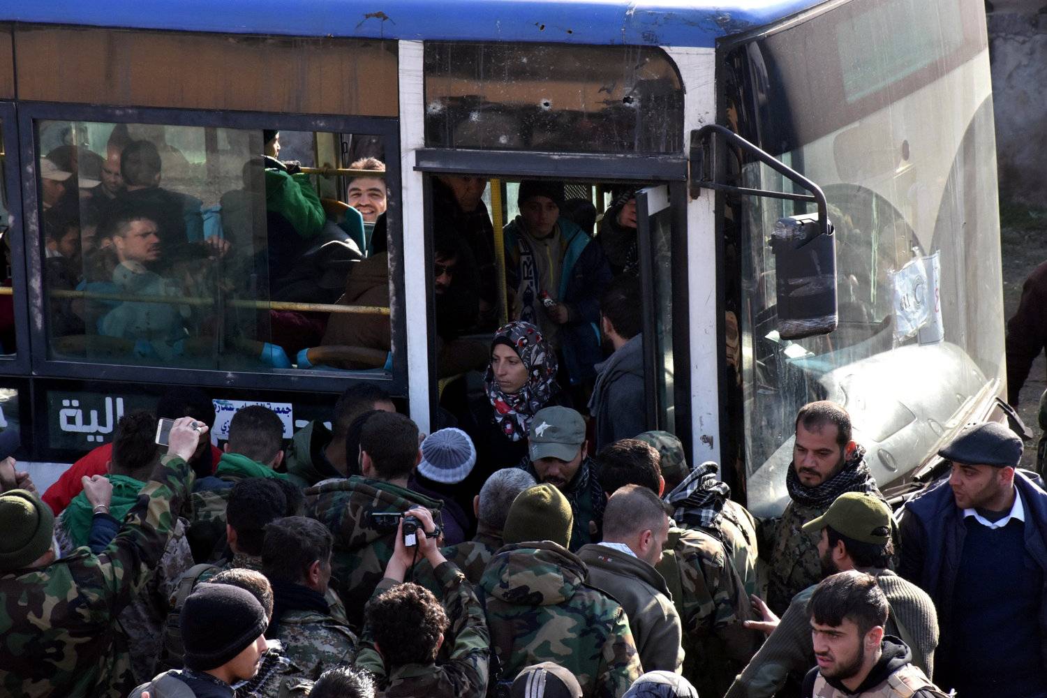 People who fled the Shi'ite Muslim villages of al-Foua and Kefraya arrive in government controlled Jibreen area in Aleppo