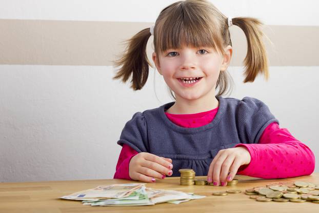 Happy girl is playing with money