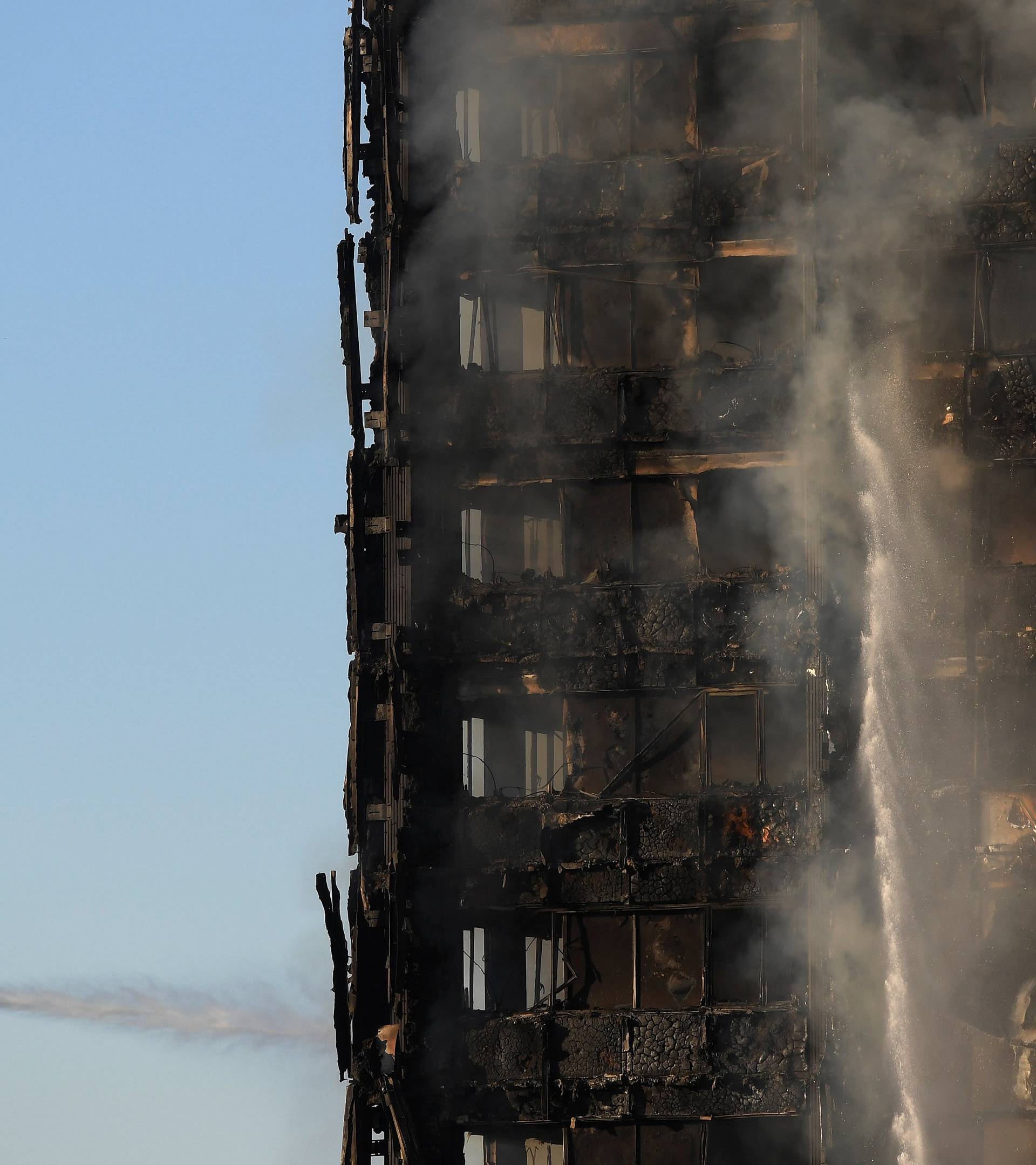 Firefighters tackle a serious fire in a tower block at Latimer Road in West London
