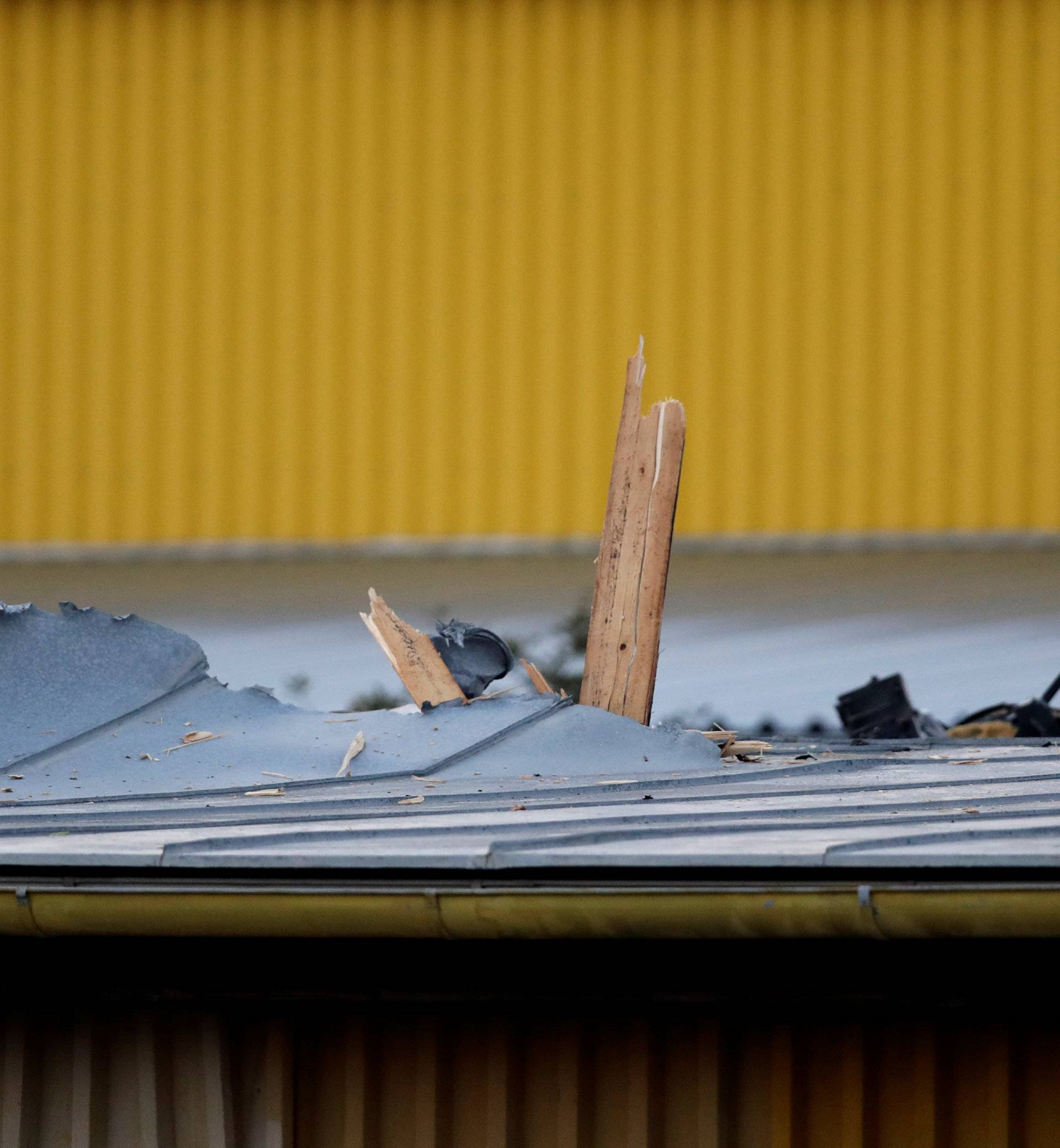 A damaged roof is seen on the site where a small helicopter crashed into an industrial hall in Plzen