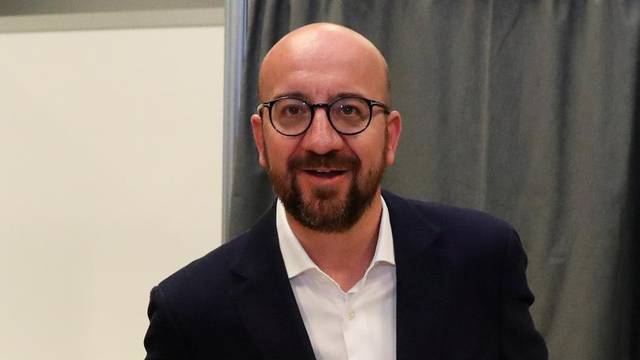 Belgian Prime Minister Charles Michel casts his vote for the Belgian general and regional elections and for the European Parliament Elections in Limal
