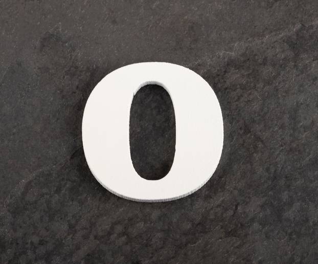 Letter O from blank alphabet on gray background - Top view