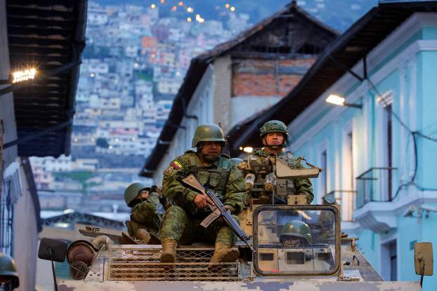 Security forces patrol after a violence outbreak, in Quito