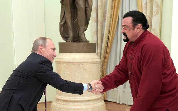 FILE PHOTO: Russia's President Putin meets U.S. actor Seagal in Moscow