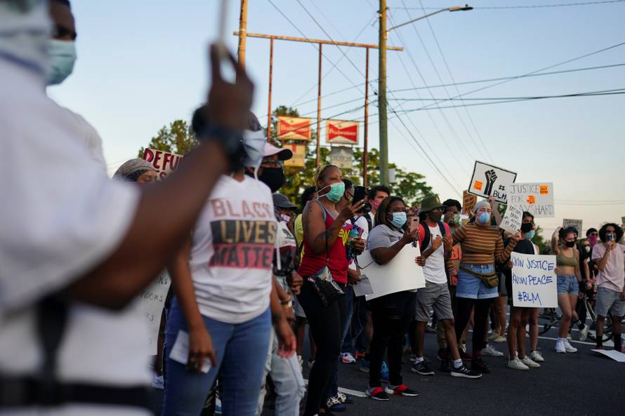 Protesters rally against racial inequality and the police shooting death of Rayshard Brooks, in Atlanta