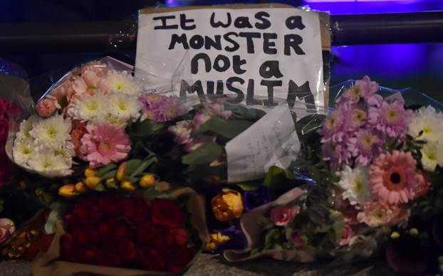 Floral tributes are seen in Westminster the day after an attack in London