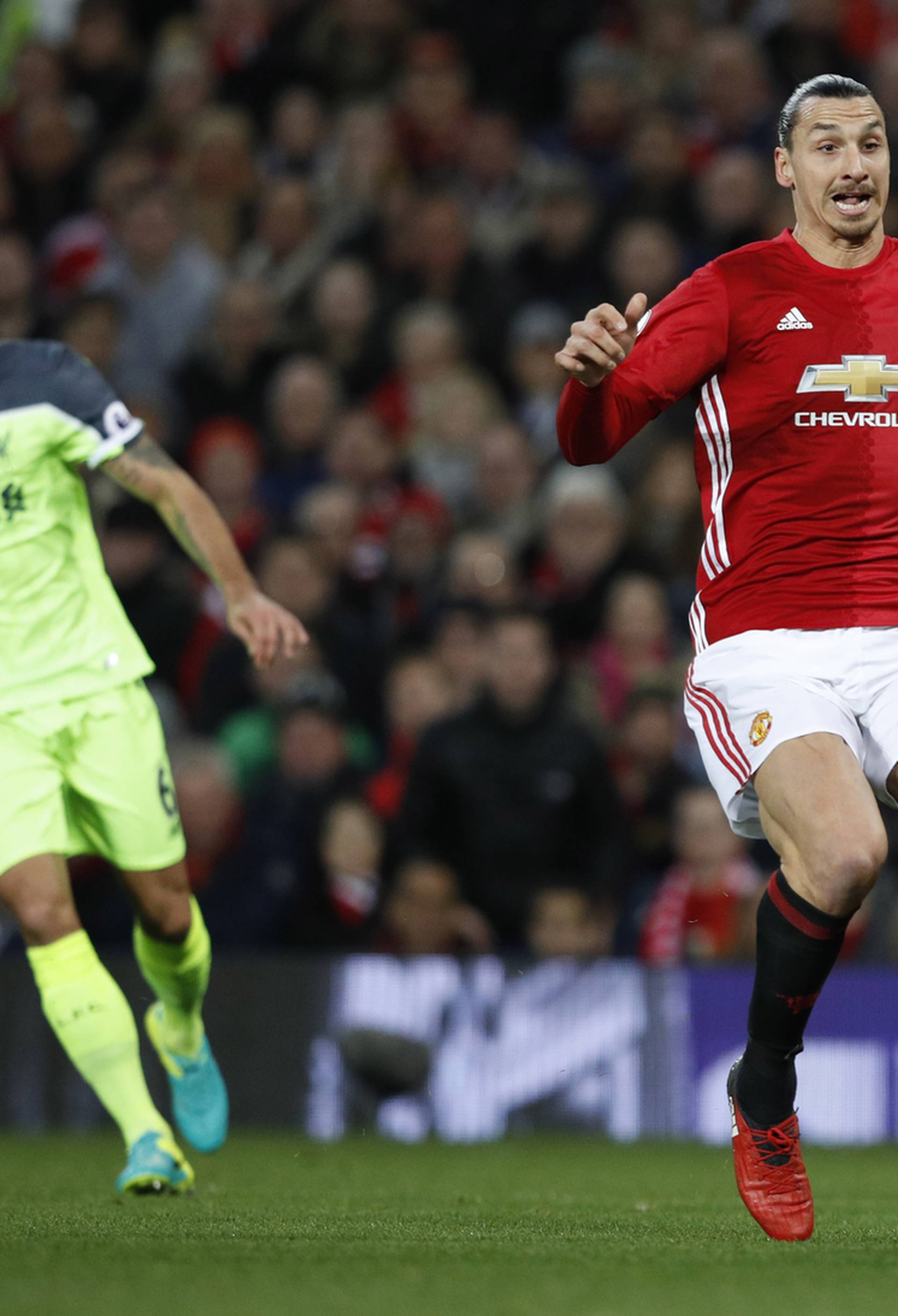 Manchester United's Zlatan Ibrahimovic blocks the clearance of Liverpool's Simon Mignolet