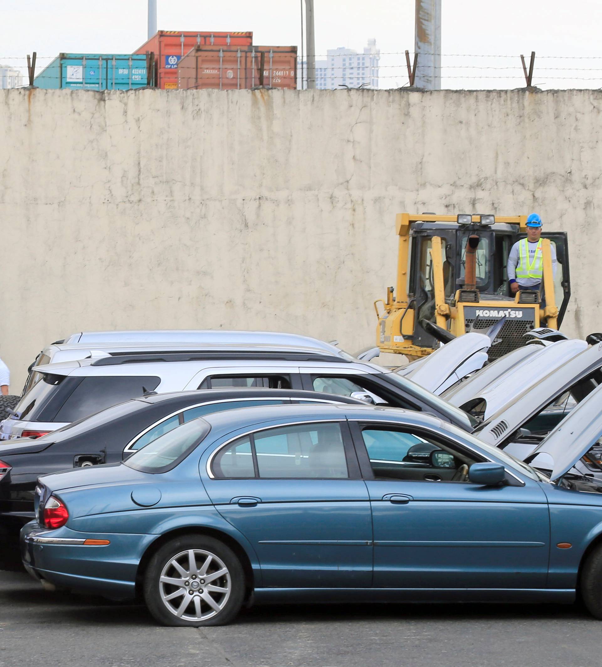 President Rodrigo Duterte inspects condemned for destruction smuggled luxury cars worth 61,626,000.00 pesos (approximately US$1.2 million), during the 116th Bureau of Customs founding anniversary in Metro Manila