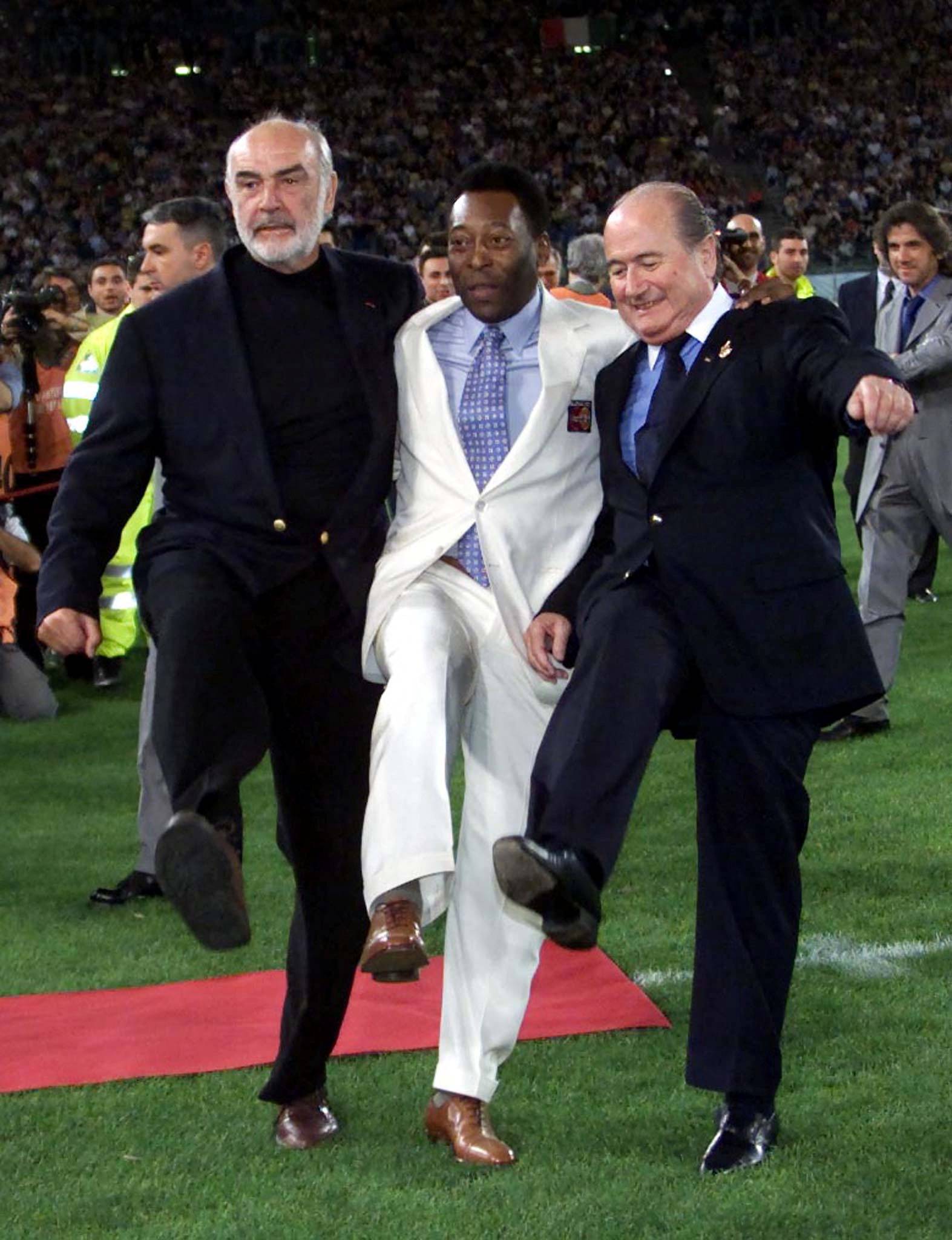 FILE PHOTO: Sepp Blatter, FIFA President, Brazilian soccer star Pele, and actor Sean Connery pose for photographers prior to the start of a charity soccer match in Rome