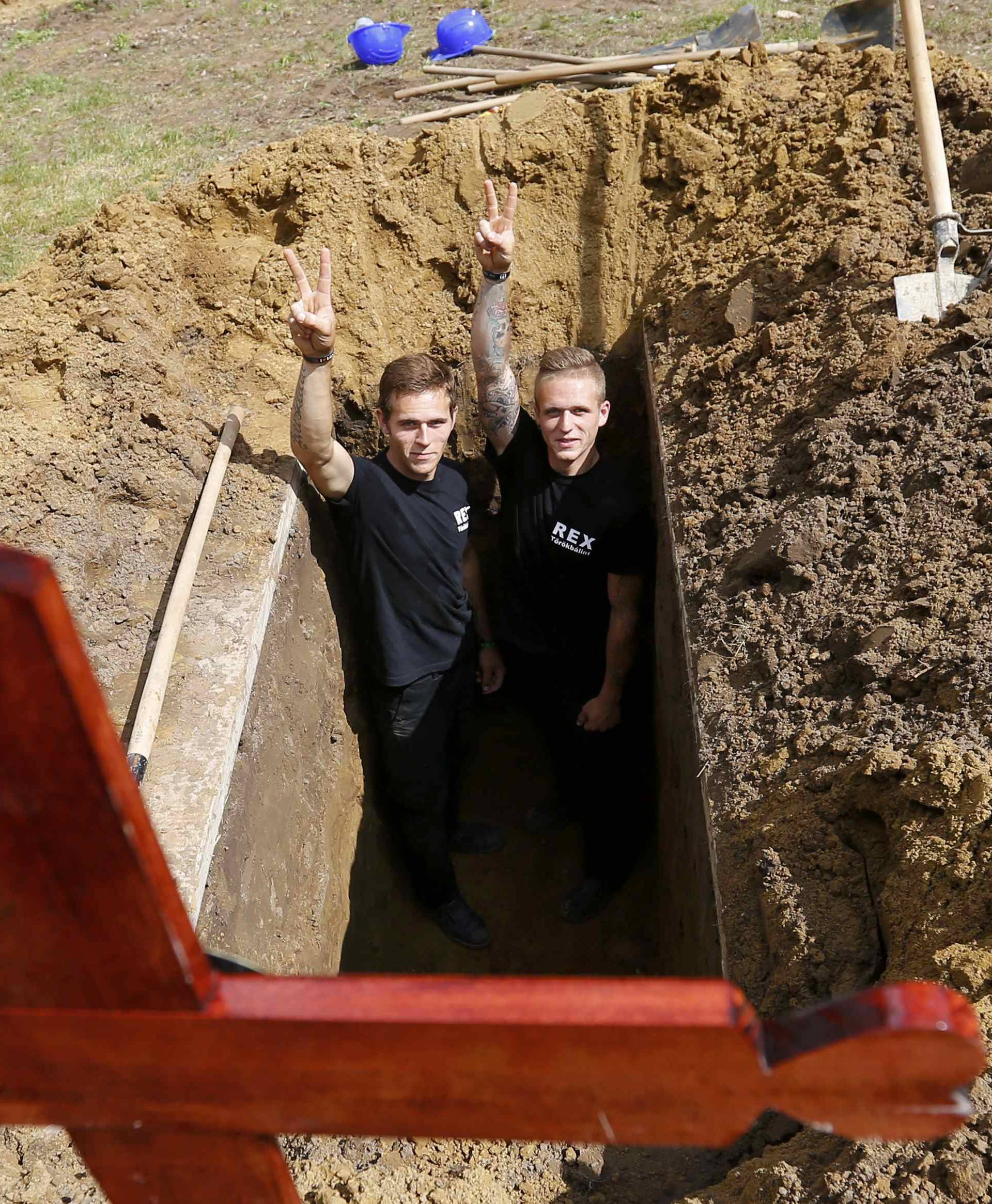Gravediggers pose after Hungarian grave digging championship in Debrecen
