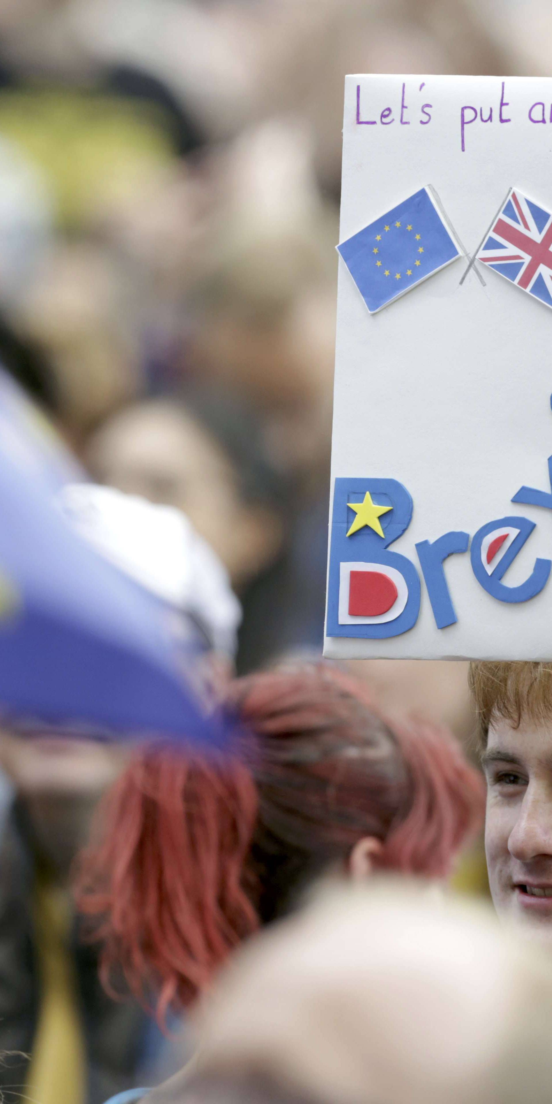A man holds a banner during a demonstration against Britain's decision to leave the European Union, in central London
