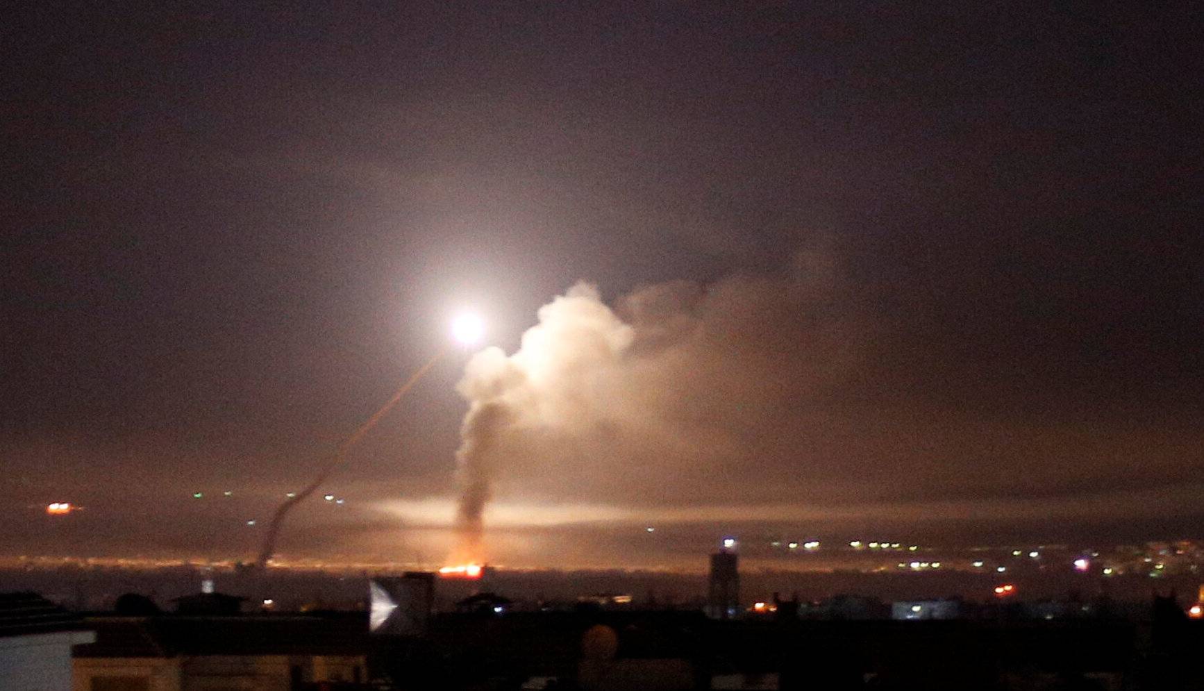 Missile fire is seen from Damascus