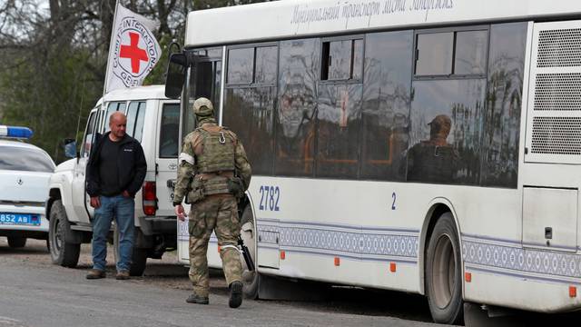 Evacuees from Mariupol travel in a convoy to Zaporizhzhia