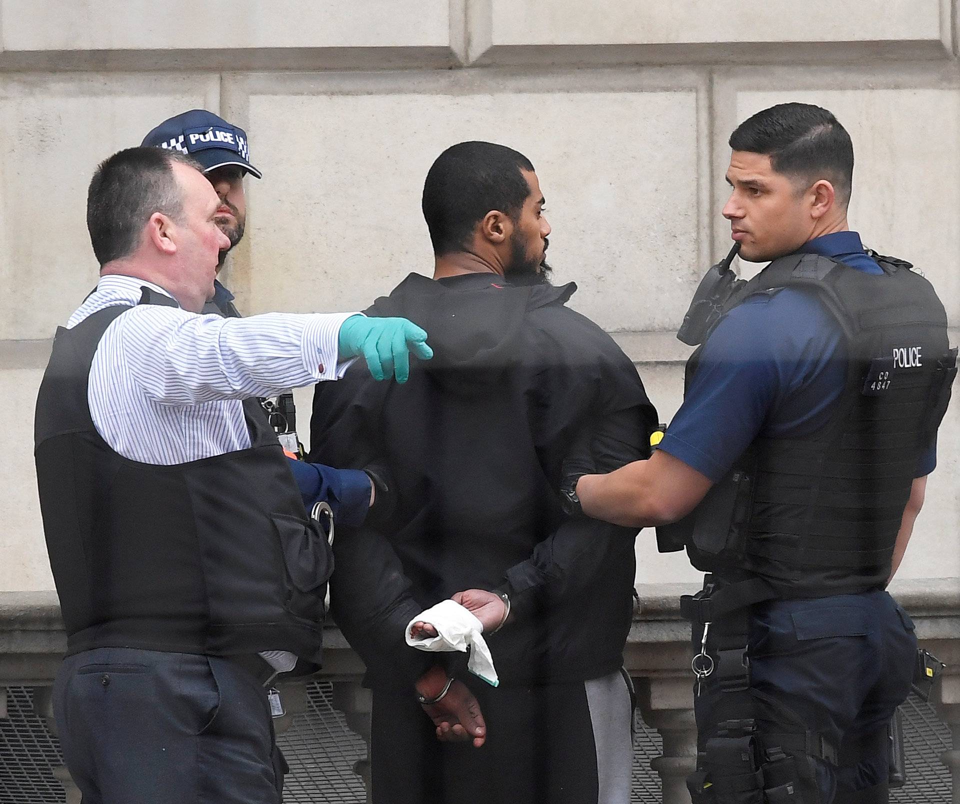 A man is held by police in Westminster after an arrest was made on Whitehall in central London