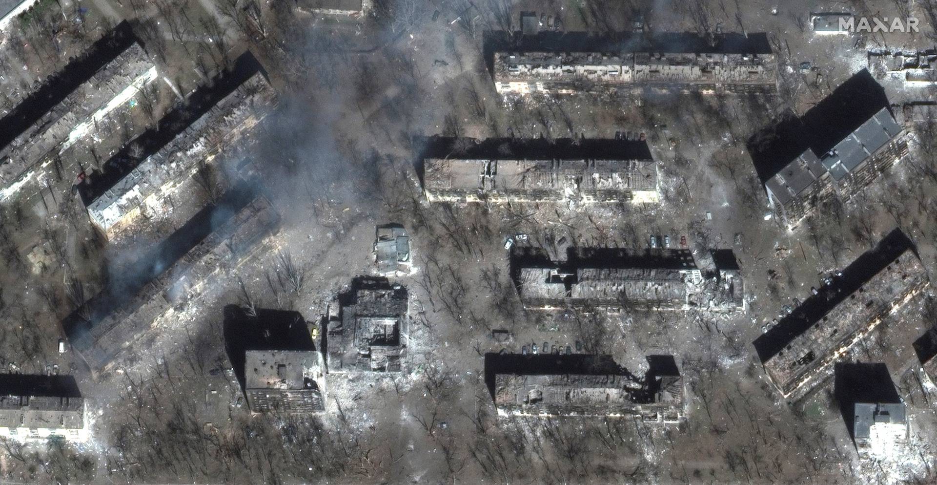 A satellite image shows devastation of residential apartment buildings, in Livoberezhnyi district, east Mariupo