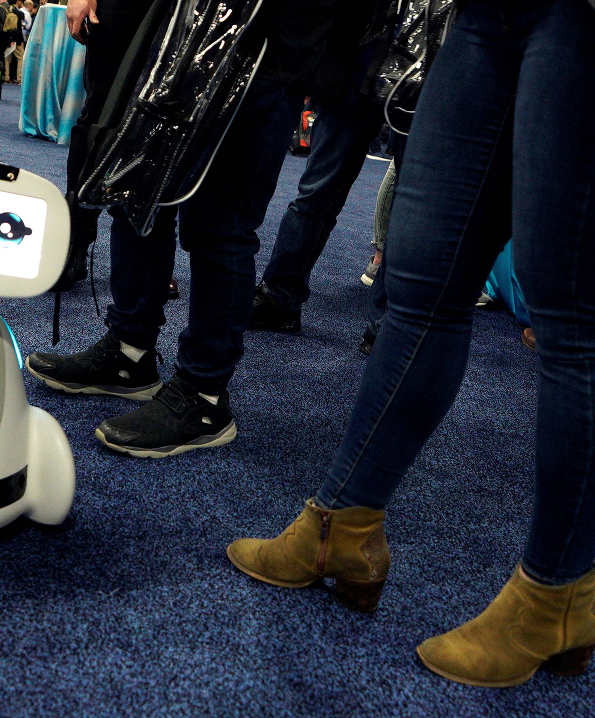 A Buddy robot by Blue Frog roams the floor during the opening event at CES in Las Vegas