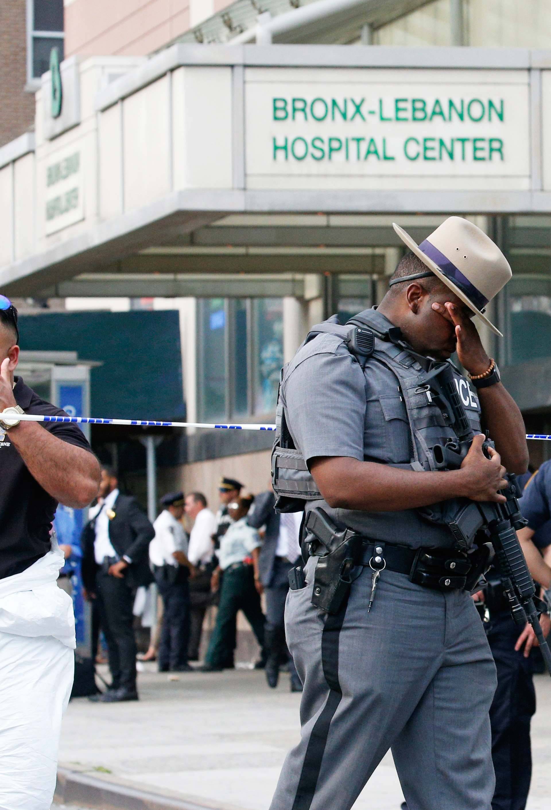 Police officers patrol the scene after an incident in which a gunman fired shots inside the Bronx-Lebanon Hospital in New York City