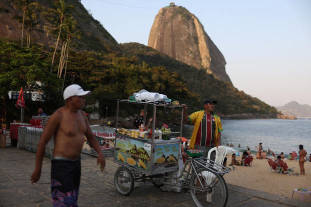 A man sells corn in Praia Vermelha beach in Rio de Janeiro