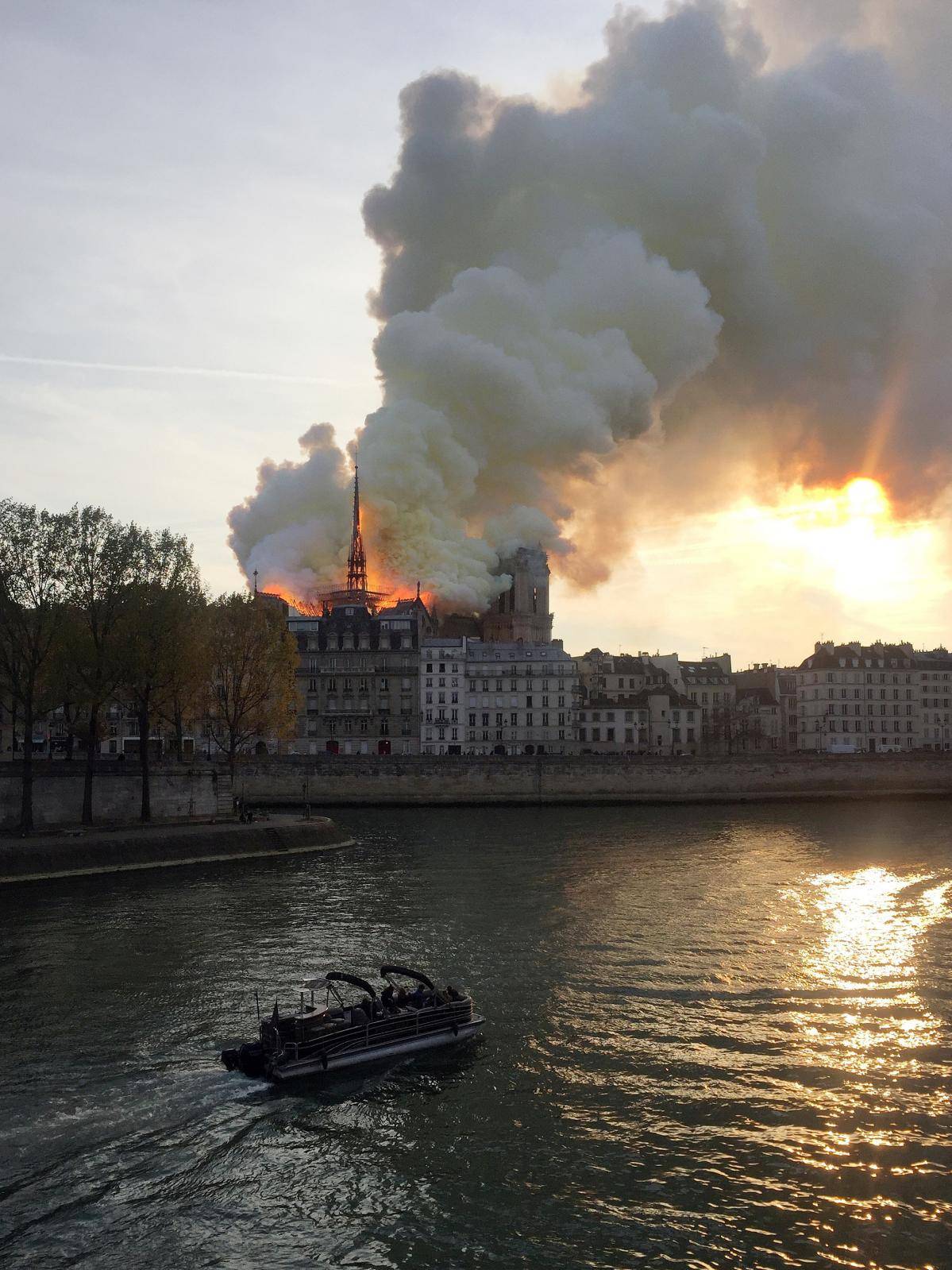 Smoke billows from the Notre Dame Cathedral after a fire broke out, in Paris