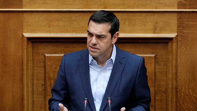Greek Prime Minister Alexis Tsipras delivers a speech during a parliamentary session on the collapse of Cyprus peace talks in Athens