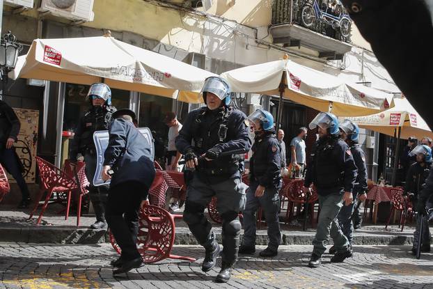 Italian police follow Eintracht Frankfurt fans walking through the streets of the city of Naples before the UEFA Champions League round of 16 return match between SSC Napoli and Eintracht Frankfurt.