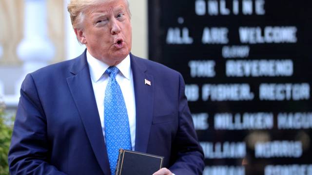 U.S. President Trump holds a Bible during photo opp in front of St John's Church in Washington