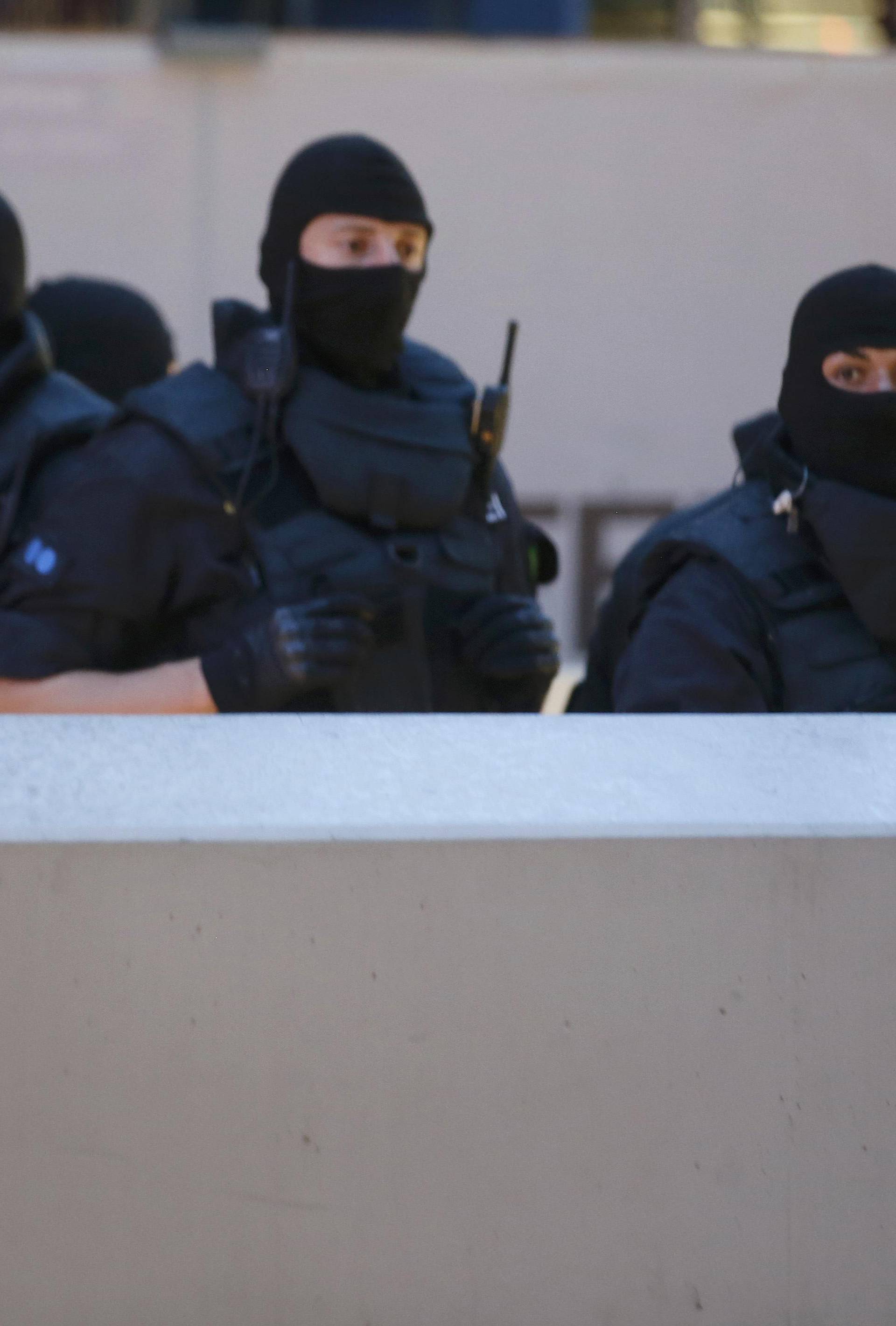 Special force police officers stand guard at entrance of main train station following shooting rampage at shopping mall in Munich