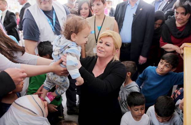 Croatia President Kolinda Grabar Kitarovic meets with migrants at Vinojug transit camp at Macedonian south border with Greece near Gevgelija