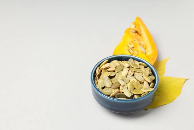 Concept of Autumn vibe food, Pumpkin, Pumpkin seeds, space for t