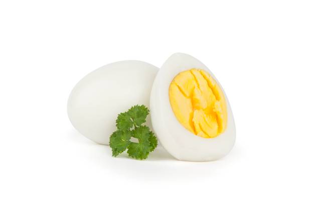 A hard boiled egg, cut in half and garnished with parsley