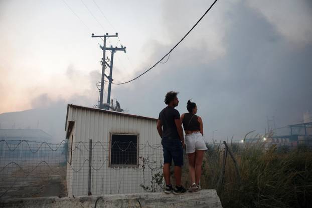 Wildfire burns houses, factories, forcing evacuations near Patras