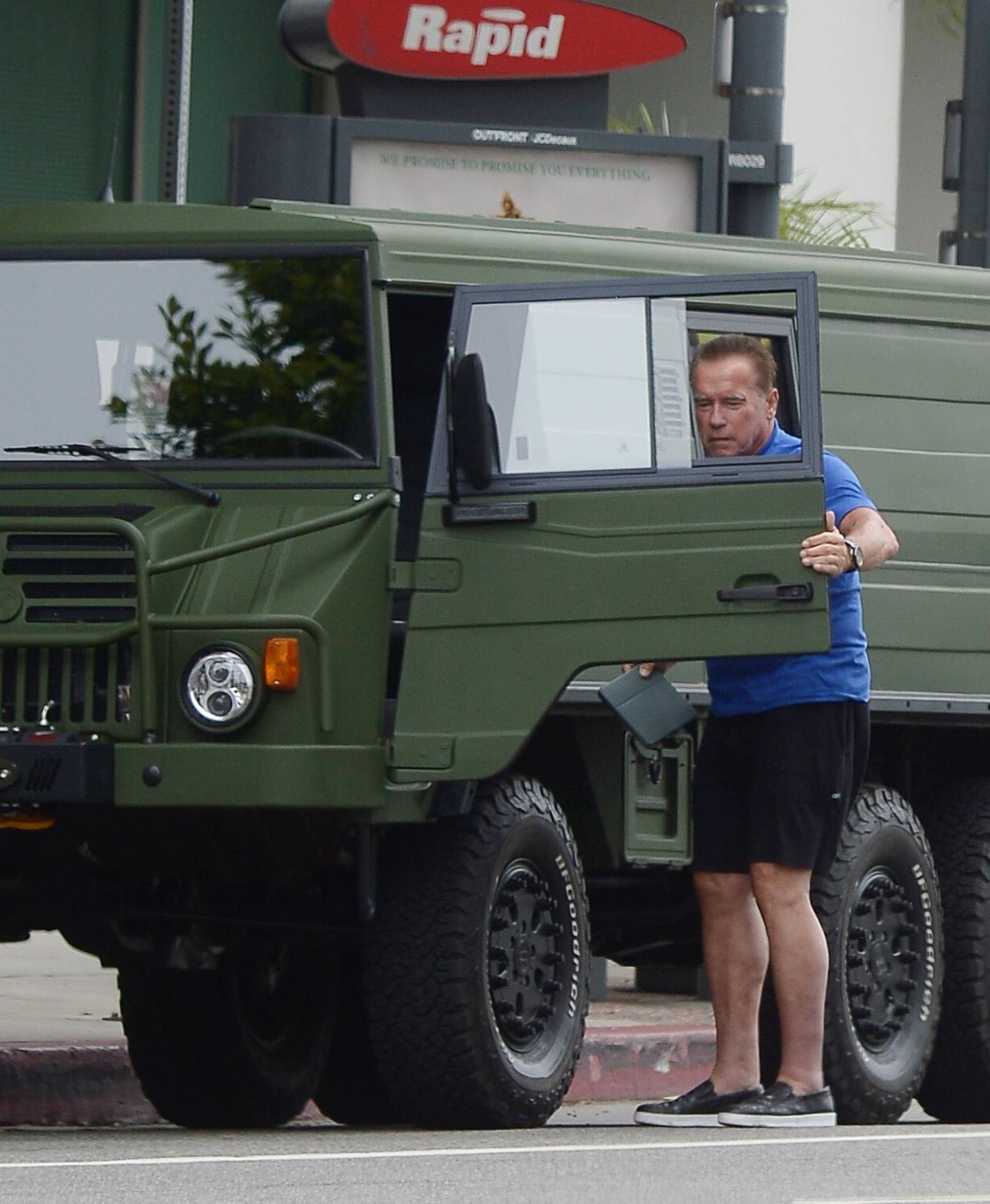 EXCLUSIVE: Arnold Schwarzenegger and Heather Milligan Run Errands in his New Military Truck.