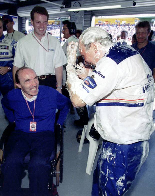 FILE PHOTO: Williams team boss Frank Williams (L) smiles at Damon Hills race engineer Dave Brown (R) after he wa..