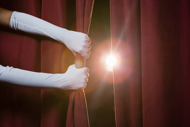 Close-up,Of,Hand,In,A,White,Glove,Pulling,Curtain,Away