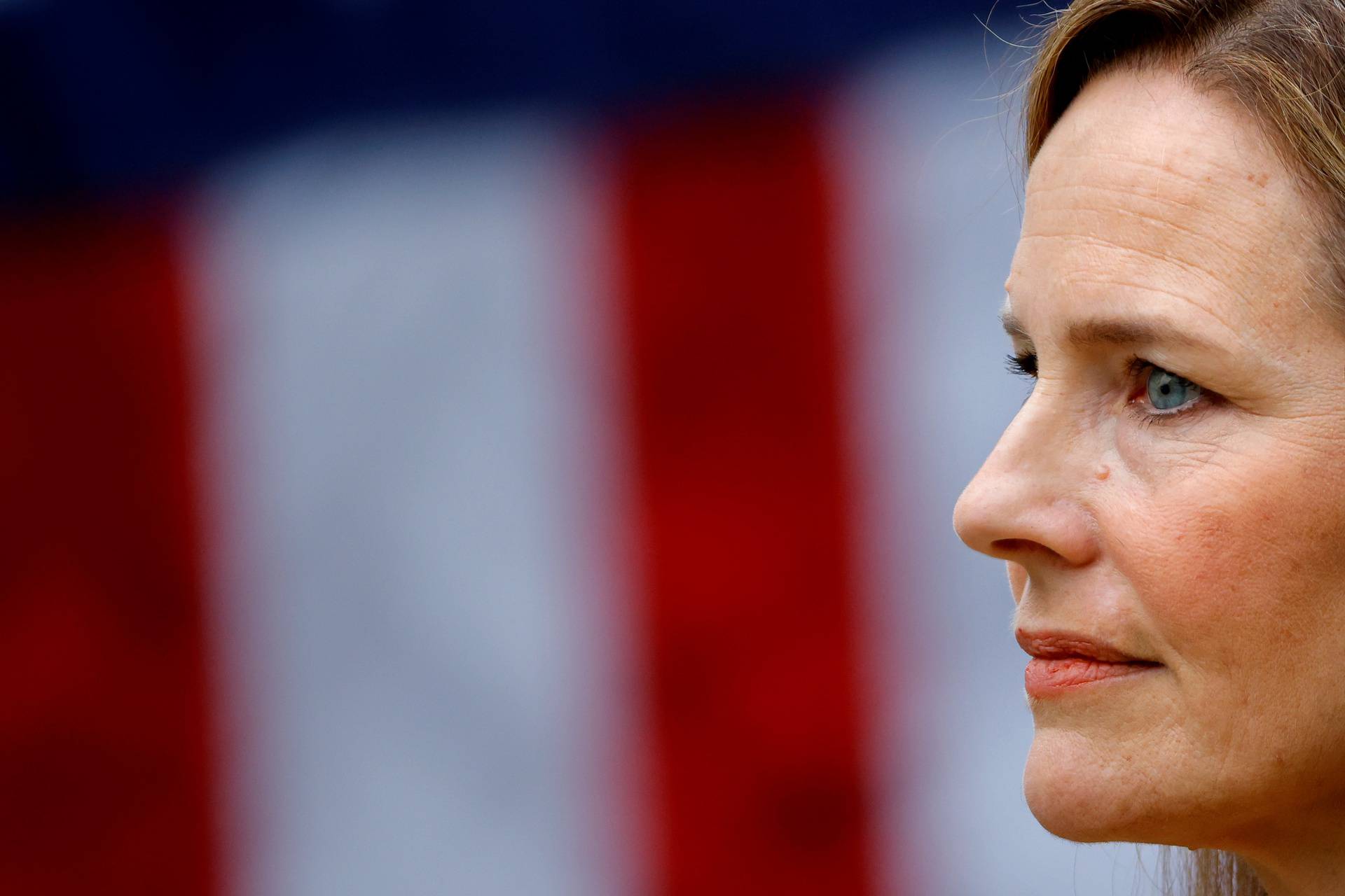 U.S. Court of Appeals for the Seventh Circuit Judge Amy Coney Barrett stands as U.S President Donald Trump holds an event to announce her nomination for the Supreme Court at the White House in Washington