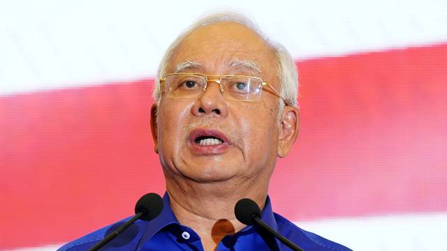 Malaysia's outgoing Prime Minister Najib Razak speaks at a news conference following the general election in Kuala Lumpur