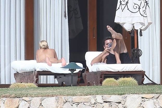 *EXCLUSIVE* Sofia Richie lounges topless with Scott Disick while on vacation