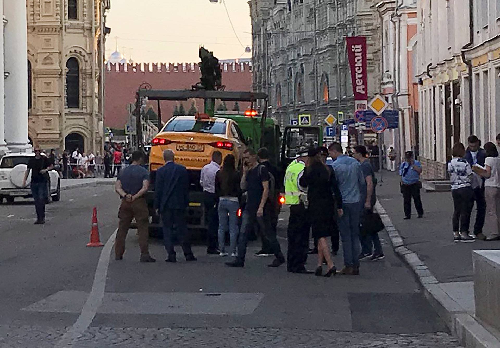 A damaged taxi, which ran into a crowd of people, is evacuated in central Moscow