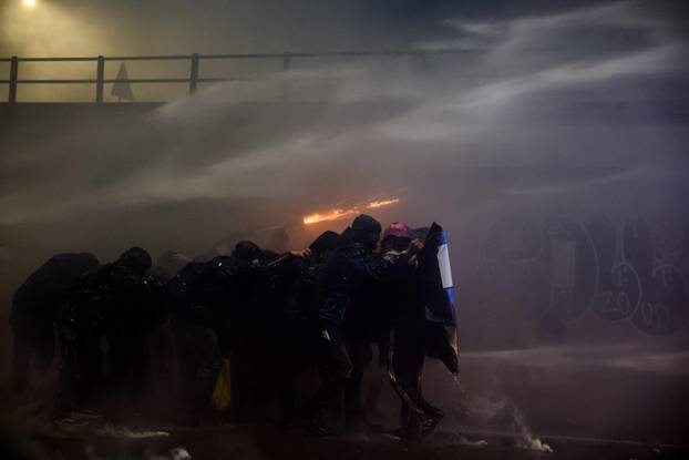 Demonstrators protest the 2026 Winter Olympics in Milan