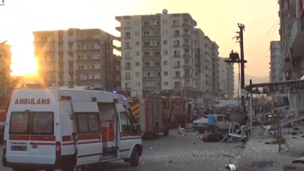 A still image taken from a video footage shows emergency vehicles at the scene of a bomb blast in Kiziltepe