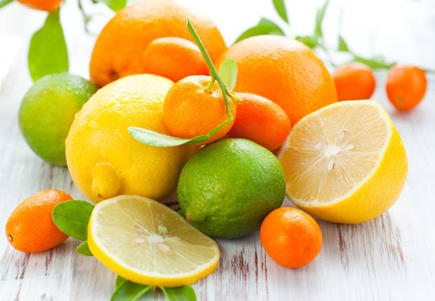 Citrus,Fresh,Fruit,On,The,White,Wooden,Table