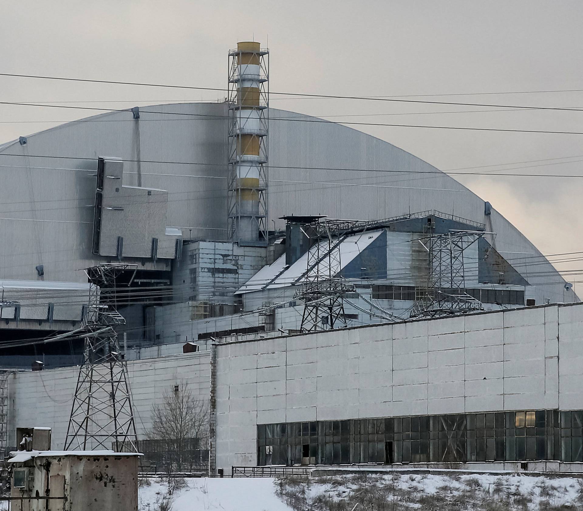 A general view shows a New Safe Confinement structure over the old sarcophagus covering the damaged fourth reactor at the Chernobyl nuclear power plant, in Chernobyl