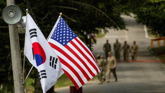 FILE PHOTO: FILE PHOTO: American and South Korean flags at Yongin South Korea