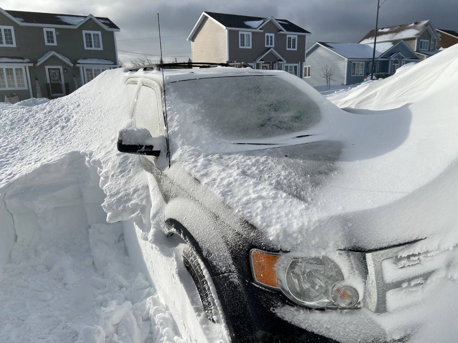 Pile of snow is pictured outside a house in St John's