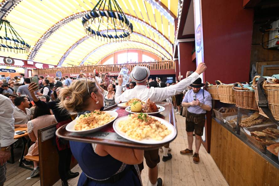 Hamburg office worker annually trades her desk for Oktoberfest waitressing